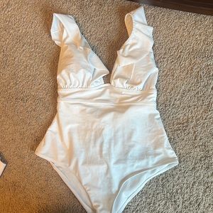 White ruffled one piece swimsuit